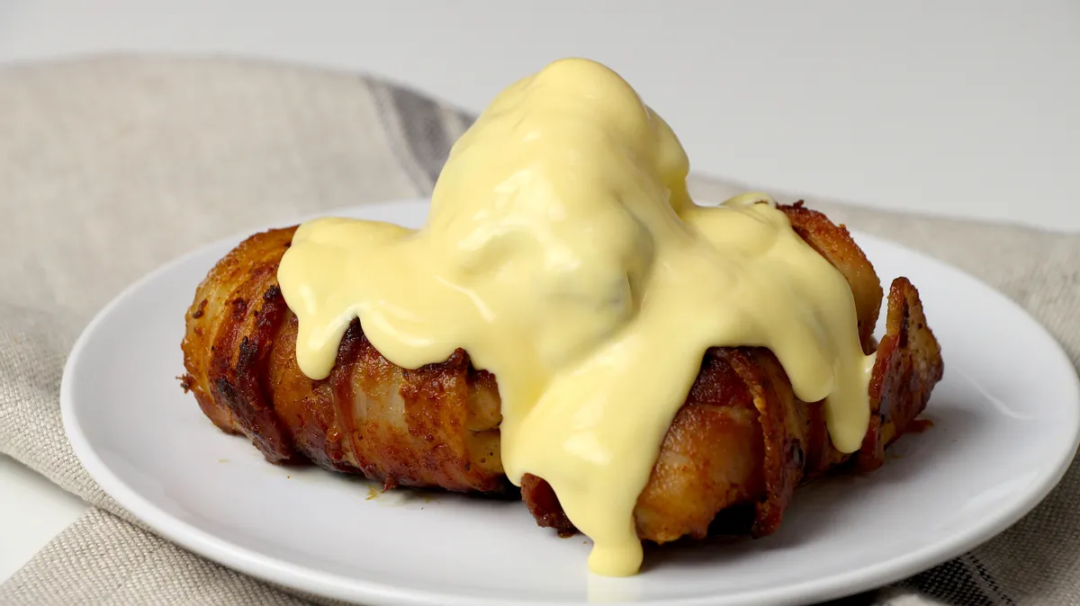 Keto Bacon Wrapped Chicken Thighs With Cheddar Sauce